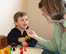 Photo of a therapist with a young patient